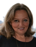 A headshot picture of school director Marina Zhgenti, smiling
